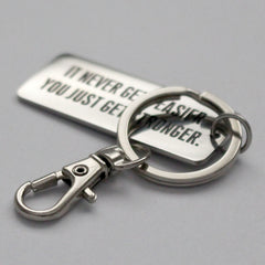 It Never Gets Easier You Just Get Stronger - Key Ring - CutAndJacked Shop