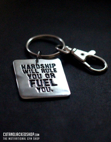 Hardship will rule you or fuel you - Key Ring
